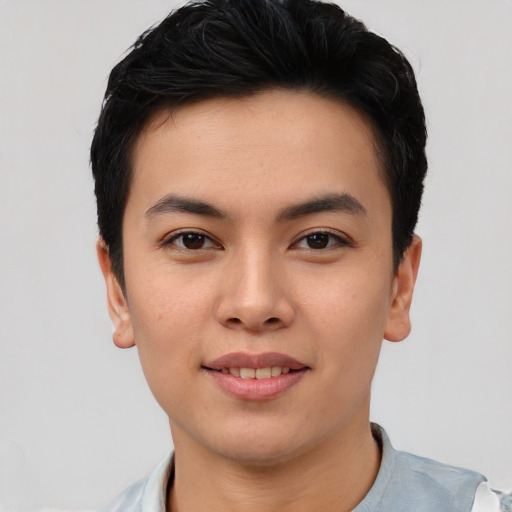 Joyful asian young-adult male with short  brown hair and brown eyes