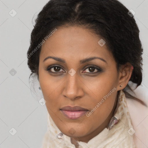 Joyful black young-adult female with long  brown hair and brown eyes