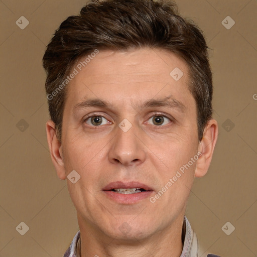 Joyful white adult male with short  brown hair and brown eyes