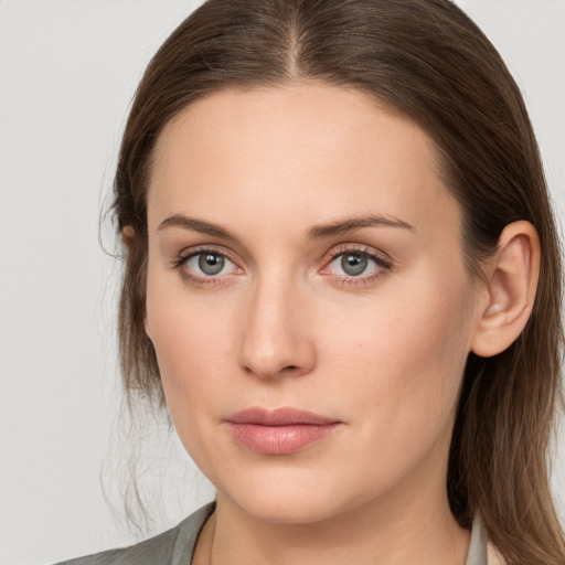 Neutral white young-adult female with long  brown hair and grey eyes