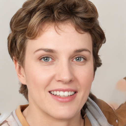 Joyful white young-adult female with medium  brown hair and blue eyes