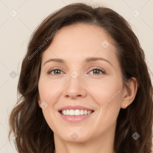 Joyful white adult female with long  brown hair and brown eyes