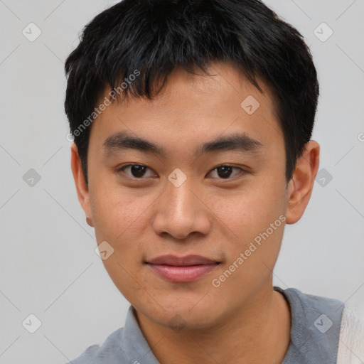 Joyful asian young-adult male with short  brown hair and brown eyes