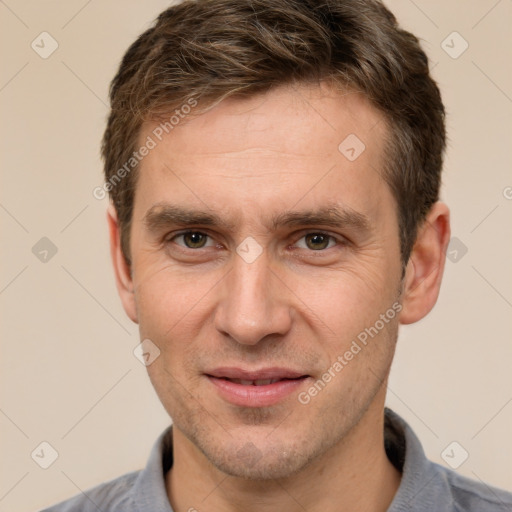 Joyful white adult male with short  brown hair and brown eyes