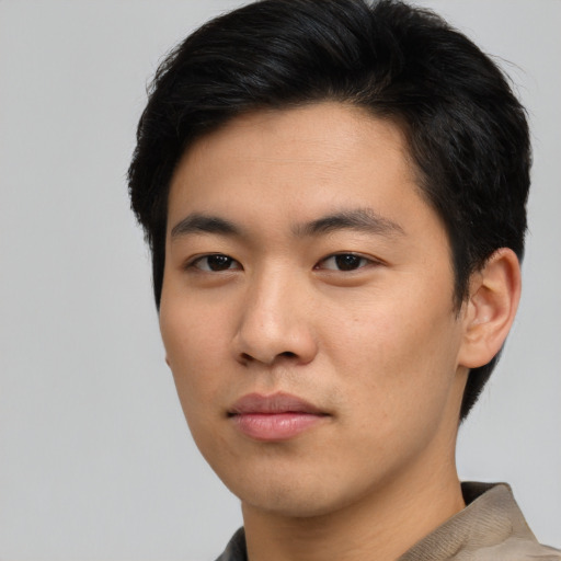 Neutral asian young-adult male with short  brown hair and brown eyes