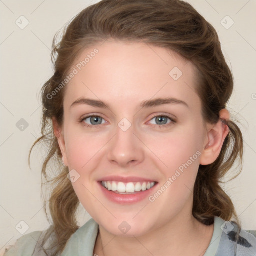 Joyful white young-adult female with medium  brown hair and blue eyes