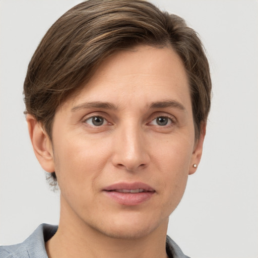 Joyful white adult female with short  brown hair and grey eyes