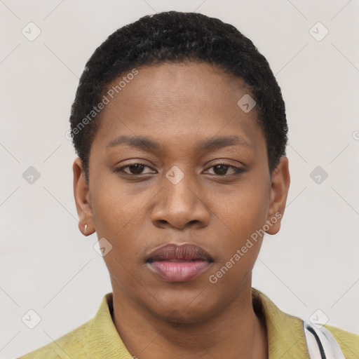 Joyful black young-adult female with short  black hair and brown eyes