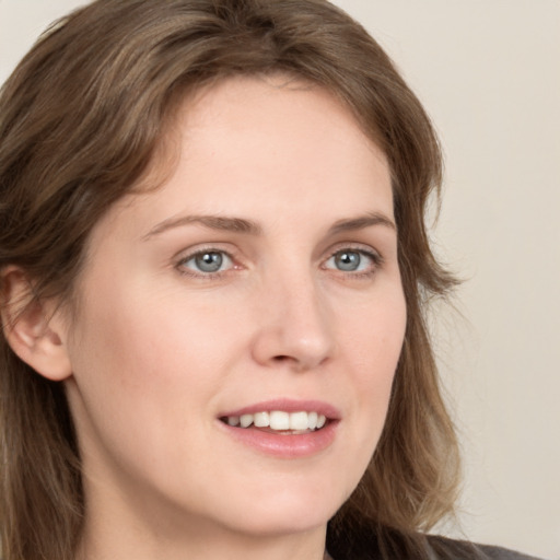 Joyful white young-adult female with medium  brown hair and blue eyes