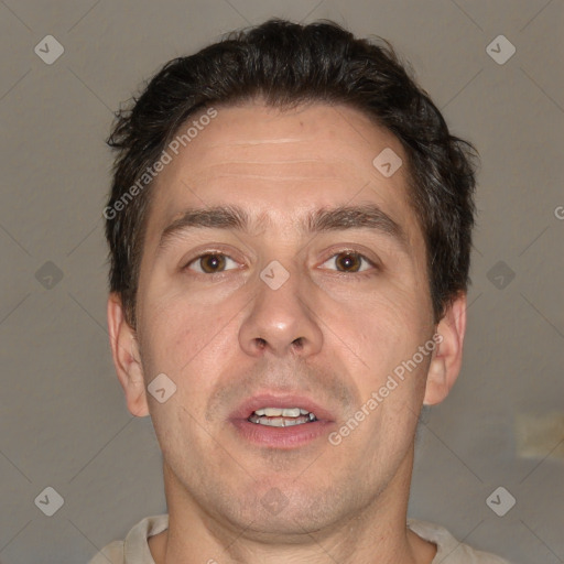 Joyful white adult male with short  brown hair and brown eyes