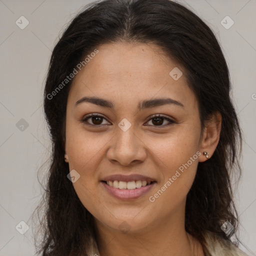 Joyful latino young-adult female with long  brown hair and brown eyes