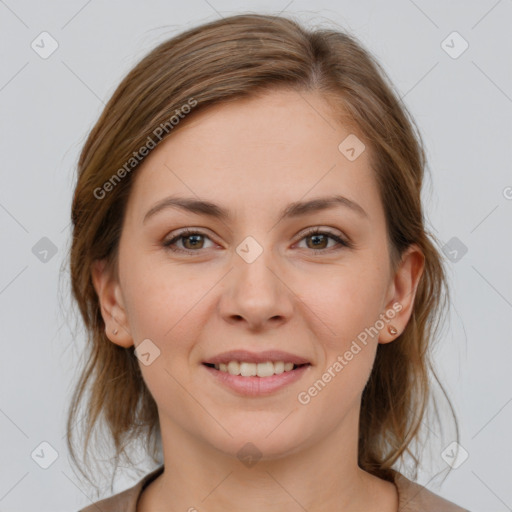 Joyful white young-adult female with medium  brown hair and grey eyes