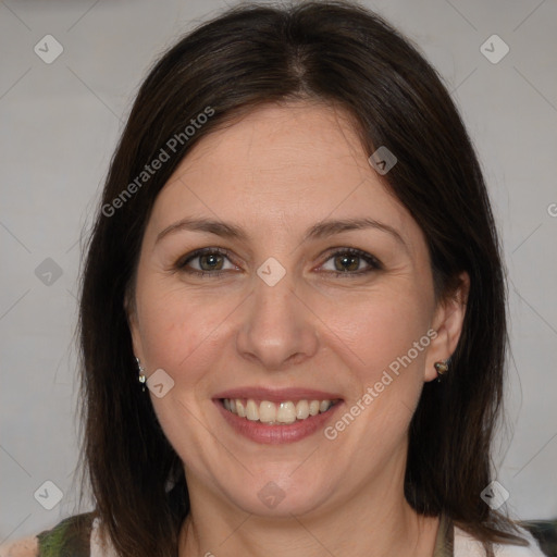 Joyful white adult female with medium  brown hair and brown eyes