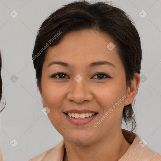 Joyful latino young-adult female with medium  brown hair and brown eyes