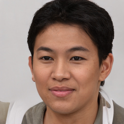 Joyful asian young-adult female with short  brown hair and brown eyes