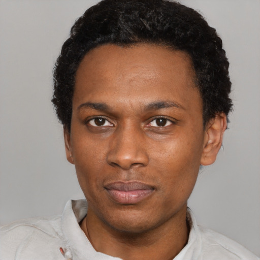 Neutral black young-adult male with short  black hair and brown eyes