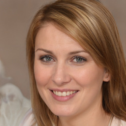 Joyful white young-adult female with medium  brown hair and blue eyes