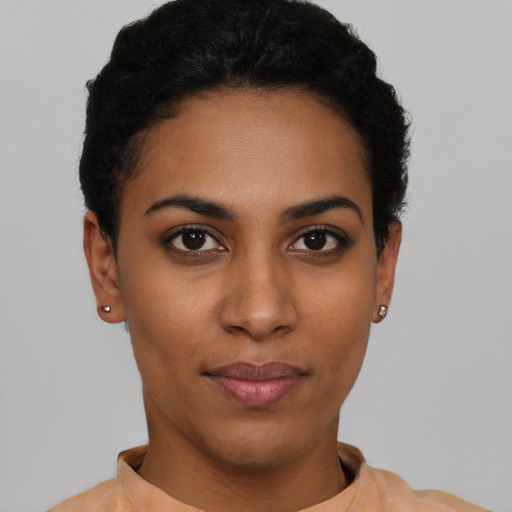 Joyful latino young-adult female with short  black hair and brown eyes