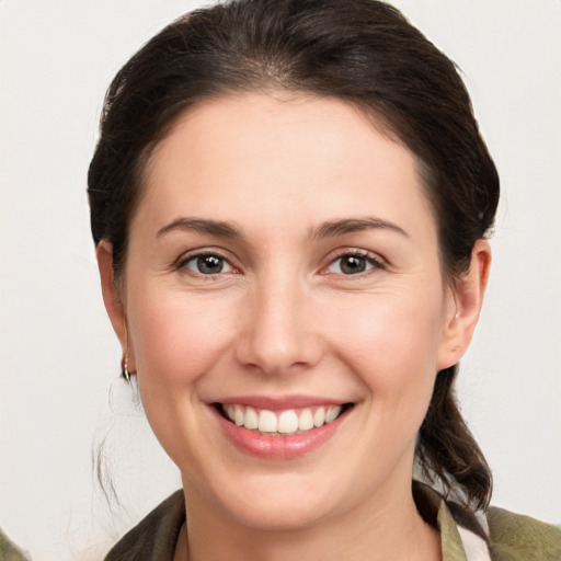 Joyful white young-adult female with medium  brown hair and brown eyes