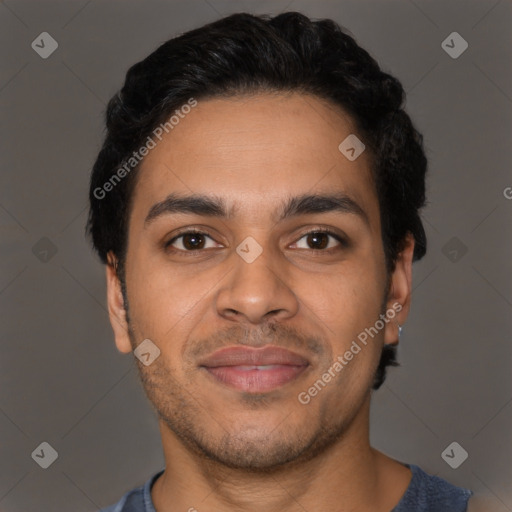 Joyful latino young-adult male with short  brown hair and brown eyes