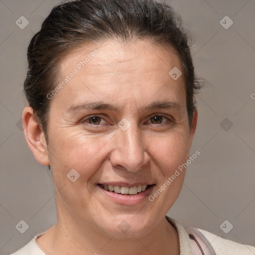 Joyful white adult female with short  brown hair and brown eyes