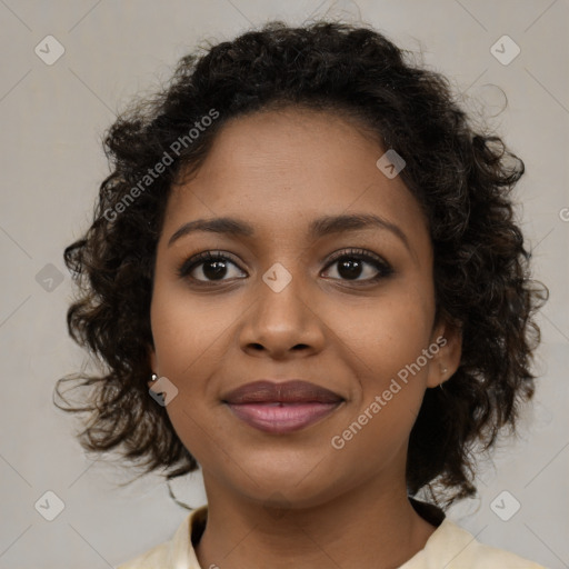 Joyful black young-adult female with medium  brown hair and brown eyes