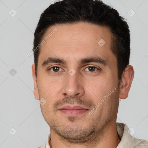 Joyful white young-adult male with short  brown hair and brown eyes