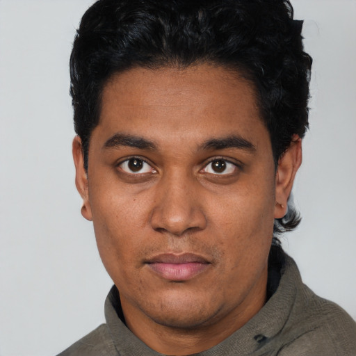 Neutral black young-adult male with short  black hair and brown eyes