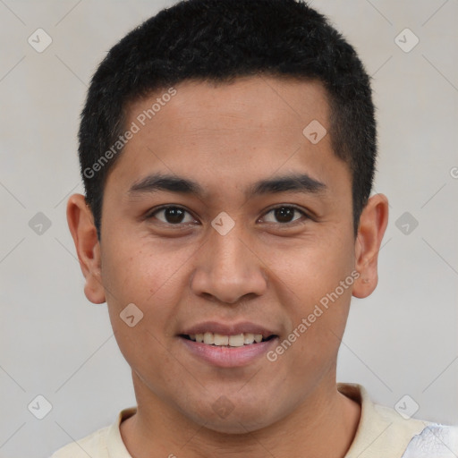 Joyful latino young-adult male with short  brown hair and brown eyes