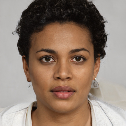 Neutral black young-adult female with short  black hair and brown eyes