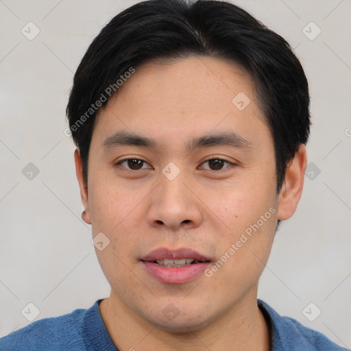 Joyful asian young-adult male with short  brown hair and brown eyes