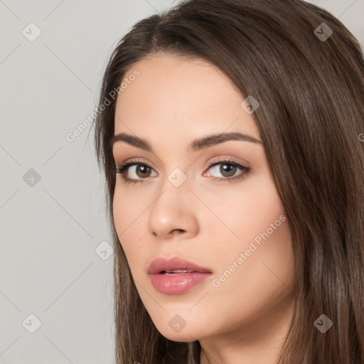 Neutral white young-adult female with long  brown hair and brown eyes