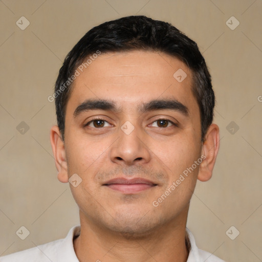 Joyful latino young-adult male with short  black hair and brown eyes