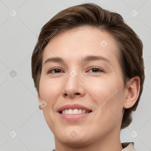 Joyful white young-adult female with short  brown hair and brown eyes