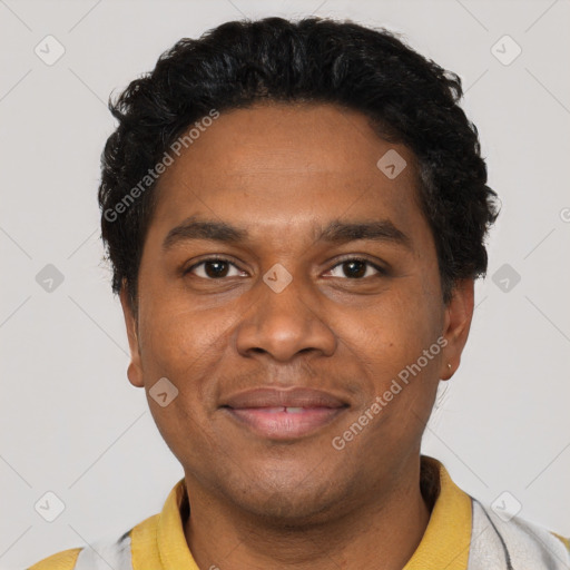 Joyful black young-adult male with short  black hair and brown eyes