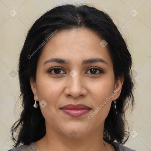 Joyful latino young-adult female with medium  brown hair and brown eyes