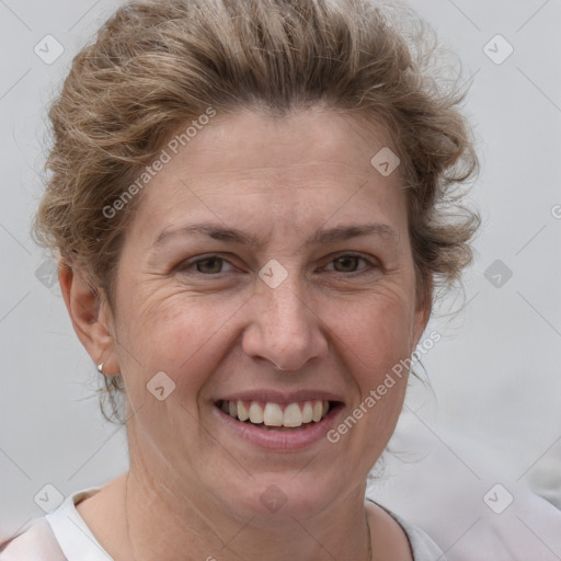 Joyful white adult female with short  brown hair and brown eyes