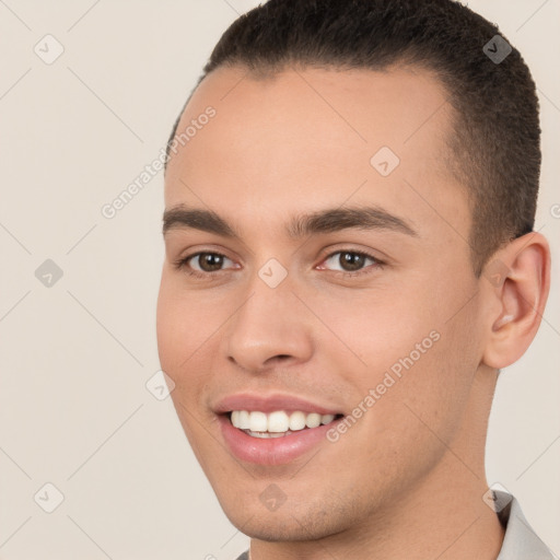 Joyful white young-adult male with short  brown hair and brown eyes