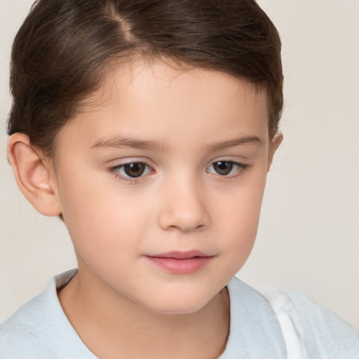 Joyful white child female with short  brown hair and brown eyes