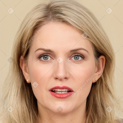 Joyful white adult female with long  brown hair and blue eyes