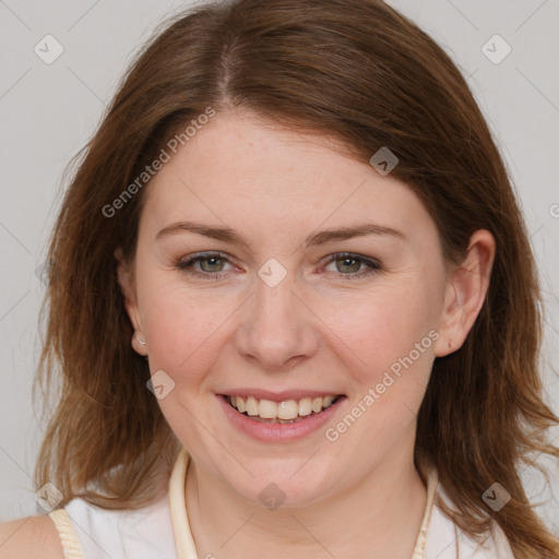 Joyful white young-adult female with medium  brown hair and blue eyes