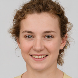 Joyful white young-adult female with medium  brown hair and green eyes