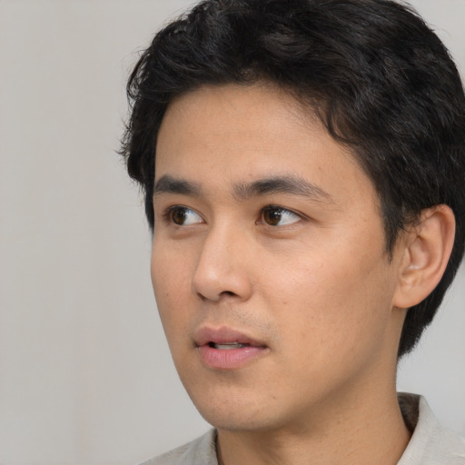 Neutral white young-adult male with short  black hair and brown eyes