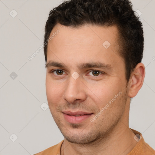 Joyful white young-adult male with short  brown hair and brown eyes