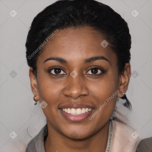 Joyful black young-adult female with short  black hair and brown eyes