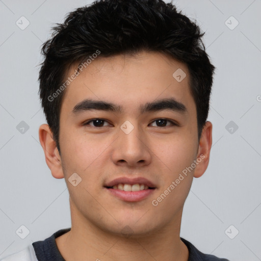 Joyful asian young-adult male with short  black hair and brown eyes