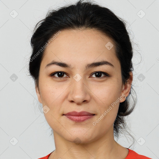 Joyful latino young-adult female with medium  brown hair and brown eyes