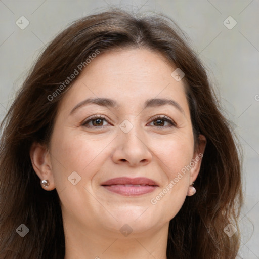 Joyful white adult female with long  brown hair and brown eyes