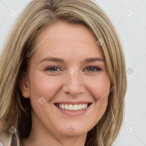 Joyful white adult female with long  brown hair and brown eyes