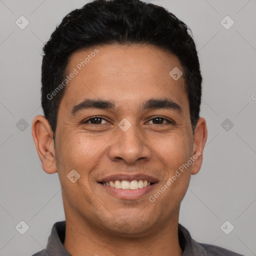 Joyful latino young-adult male with short  black hair and brown eyes